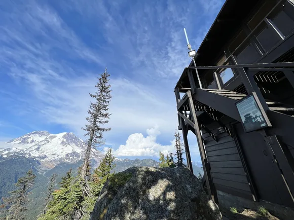 View of glaciated mountain from wooden fire lookout